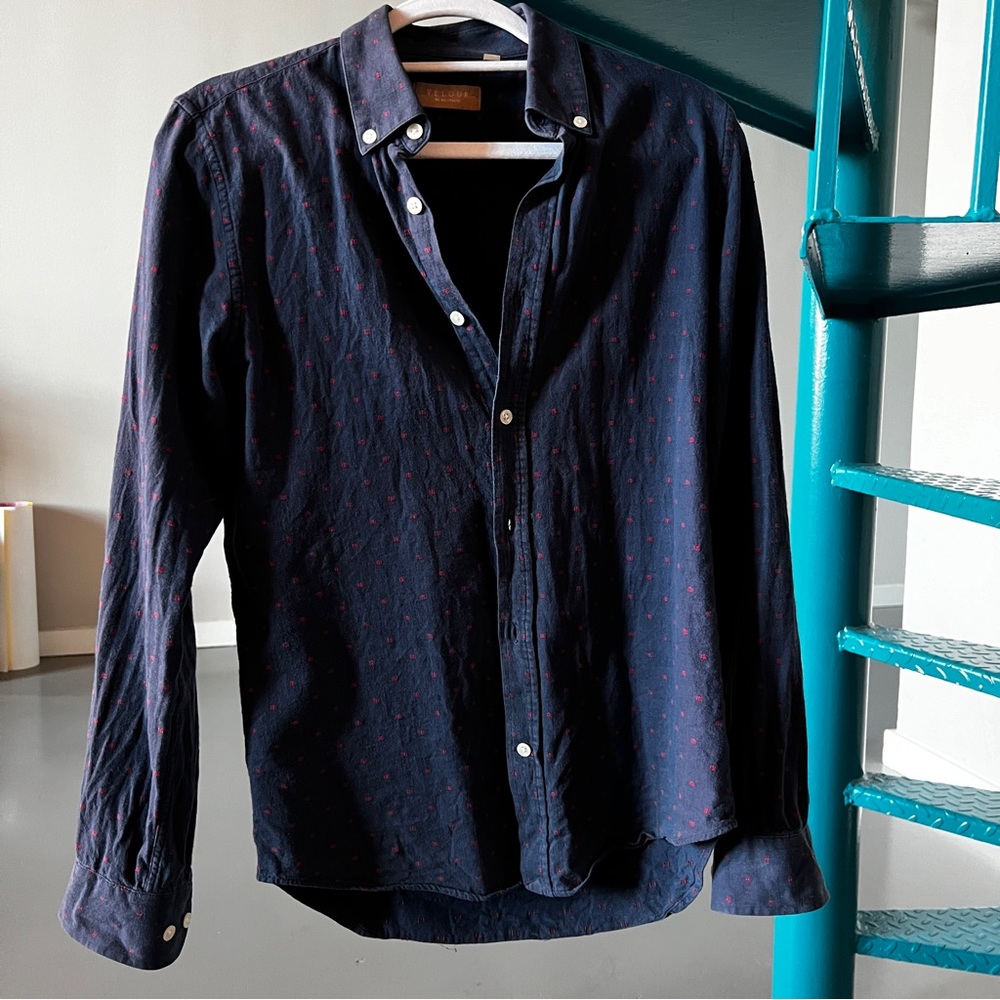 Long sleeved button down. Small red embroidery.